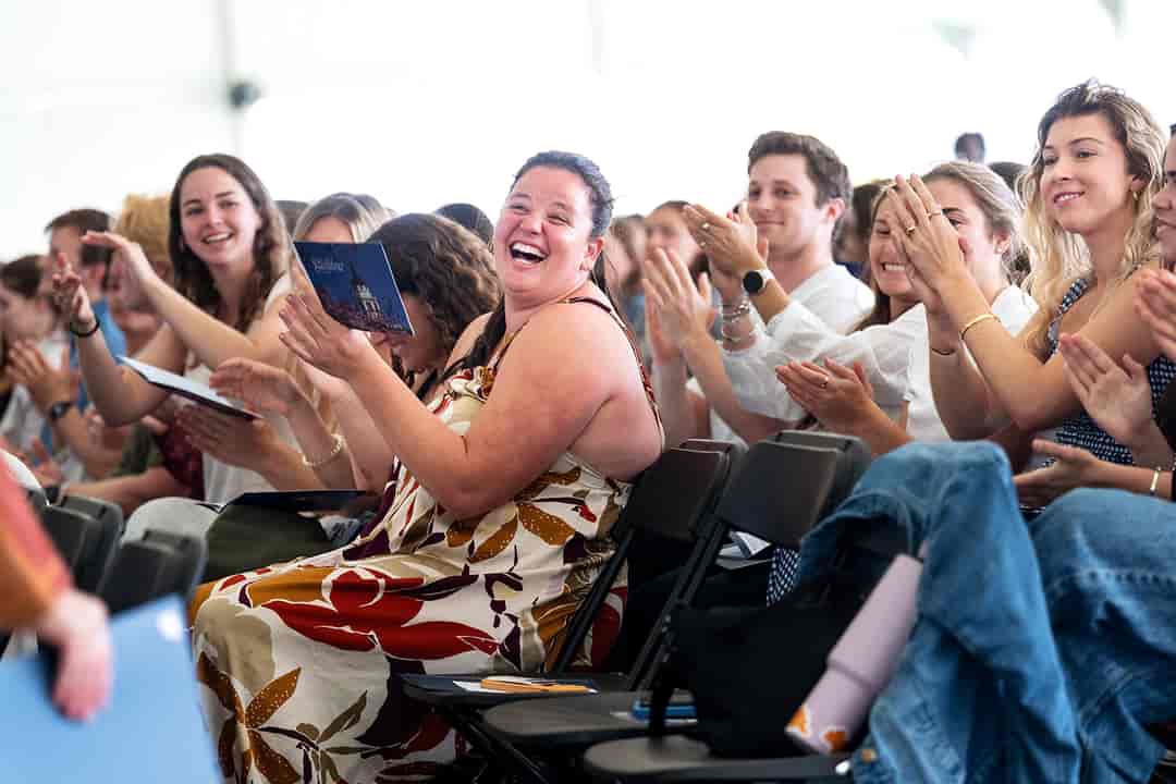 College students applauding at an awards ceremony
