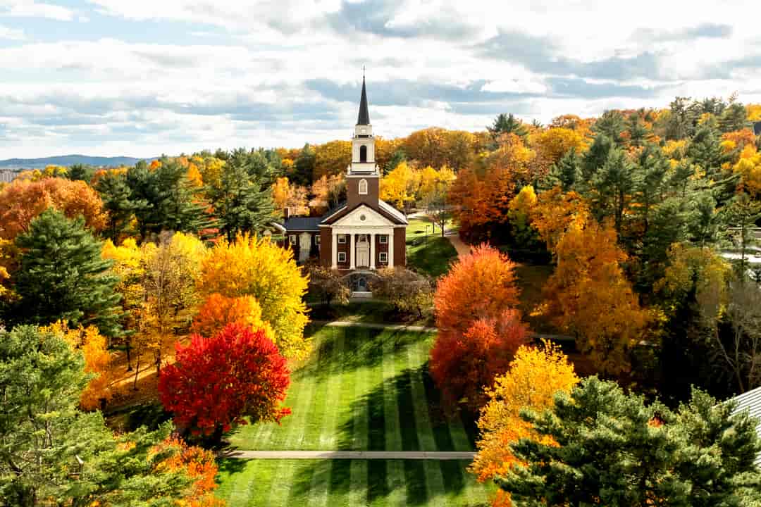 College chapel surrounded by fall trees