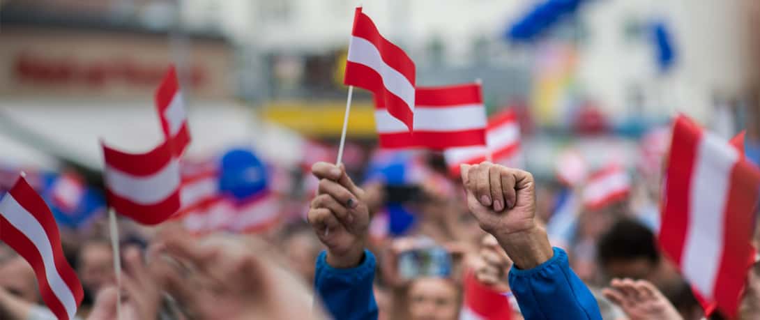 Supporters of the Austrian Freedom Party (FPOe) waving flags at the Viktor-Adler-Markt prior to elections to the National Council on September 27, 2019 in Vienna, Austria