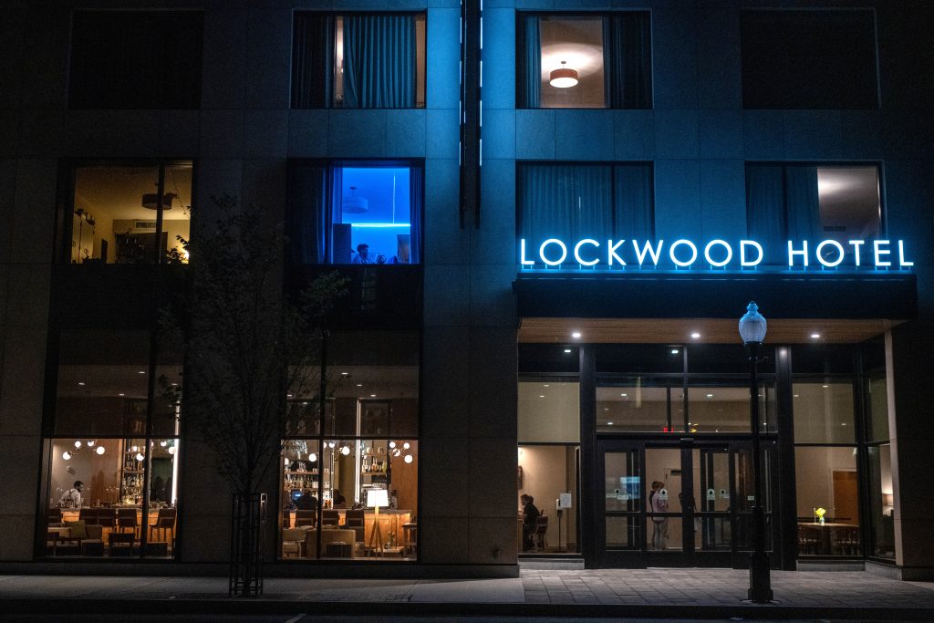 The front of the Lockwood hotel building at night.