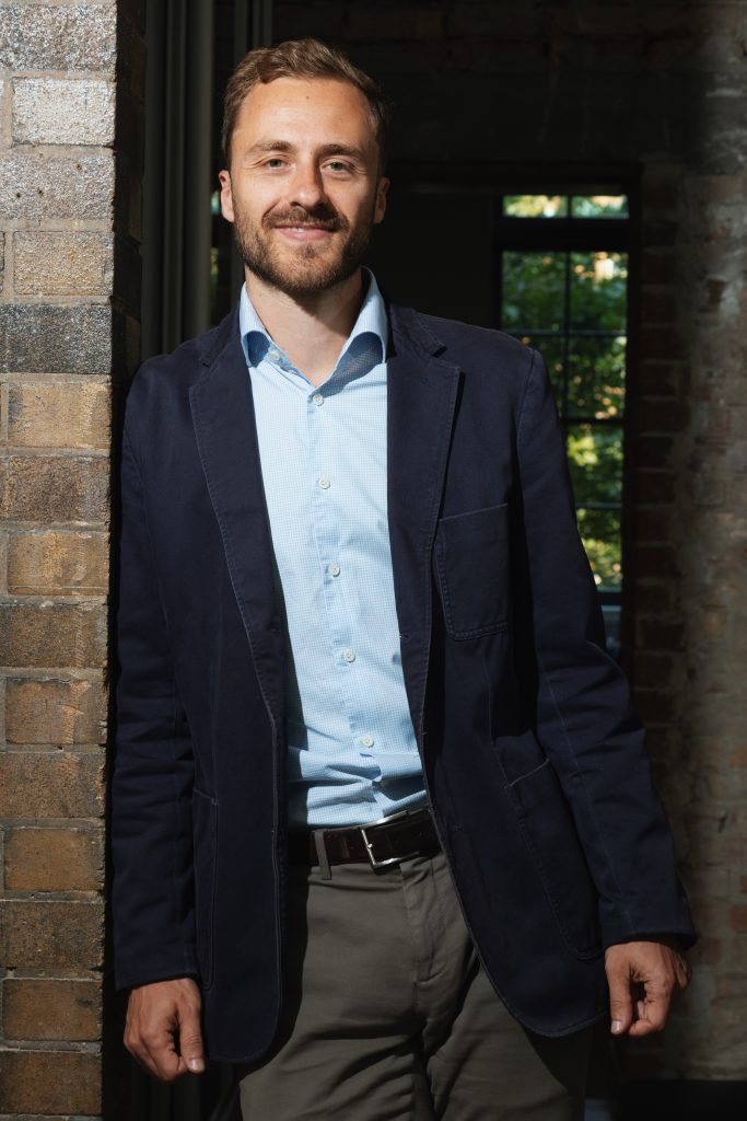 Felix Baldauf-Lenschen '14 poses at his Toronto-based startup, Altis Labs. 
