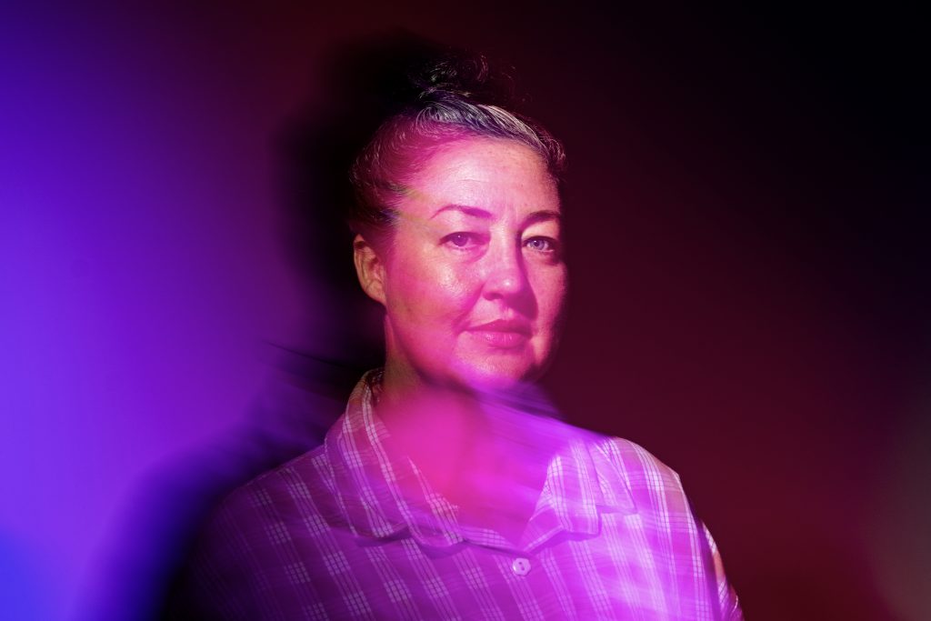 A woman facing forward poses for a photo.
