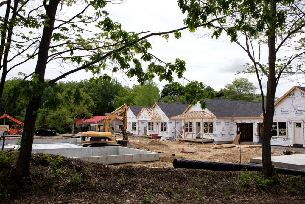 A home construction site with heavy equipment.