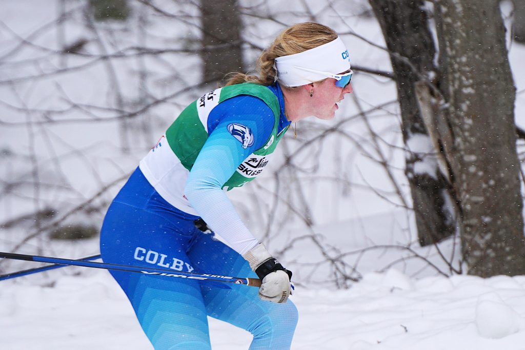 Cross-country skier Maddie Hooker skies through the woods. 
