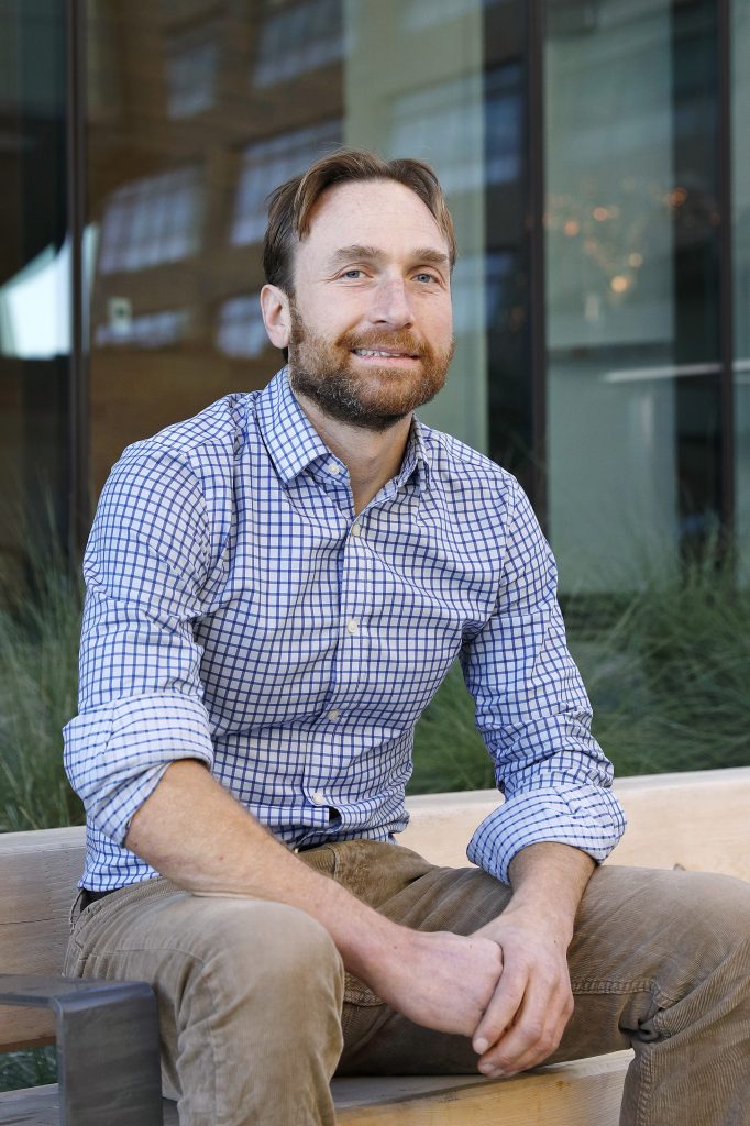 A man poses for a portrait. 