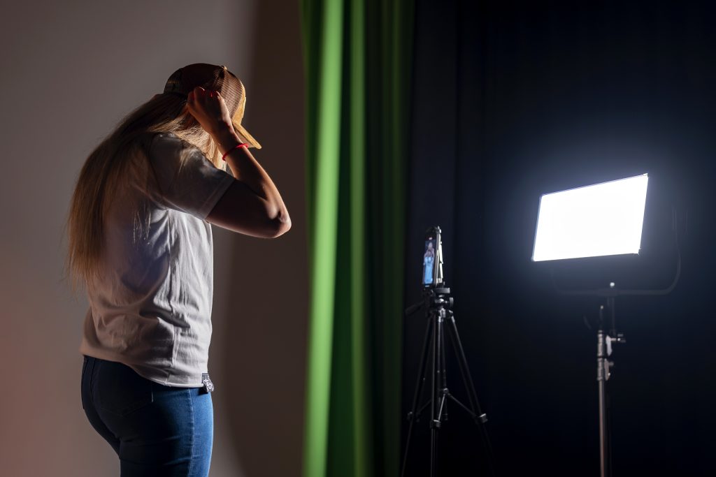 A student checks a shot in a monitor. 