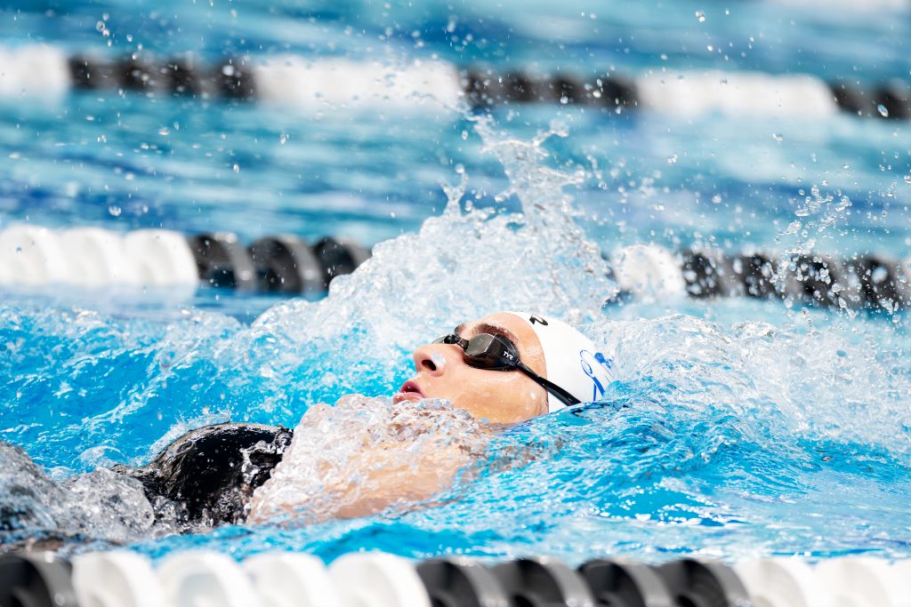 A swimming athlete doing the backstroke.
