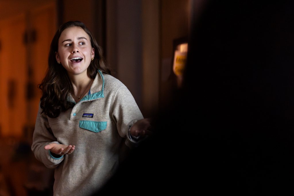A student helps lead a workshop.