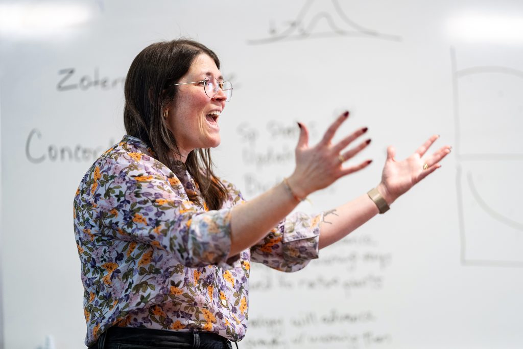 Amanda Gallinat, lecturer of environmental studies, in front of a class.