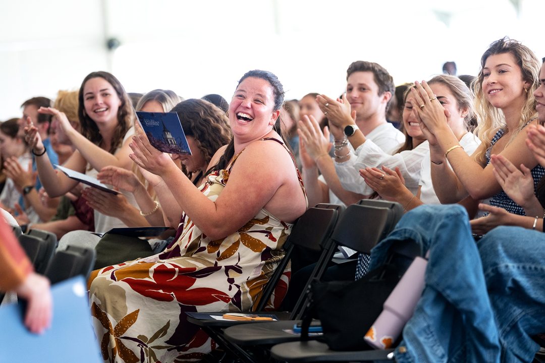 College students applauding at an awards ceremony