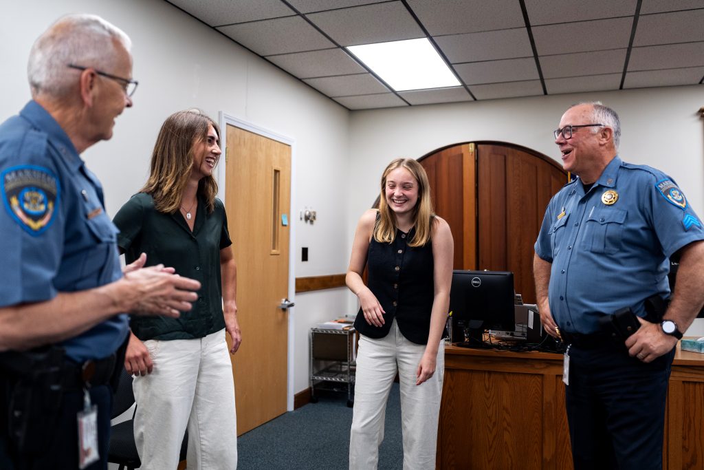 Students share a laugh with court officials