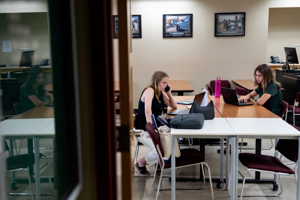 Two Colby students at work in a classroom.