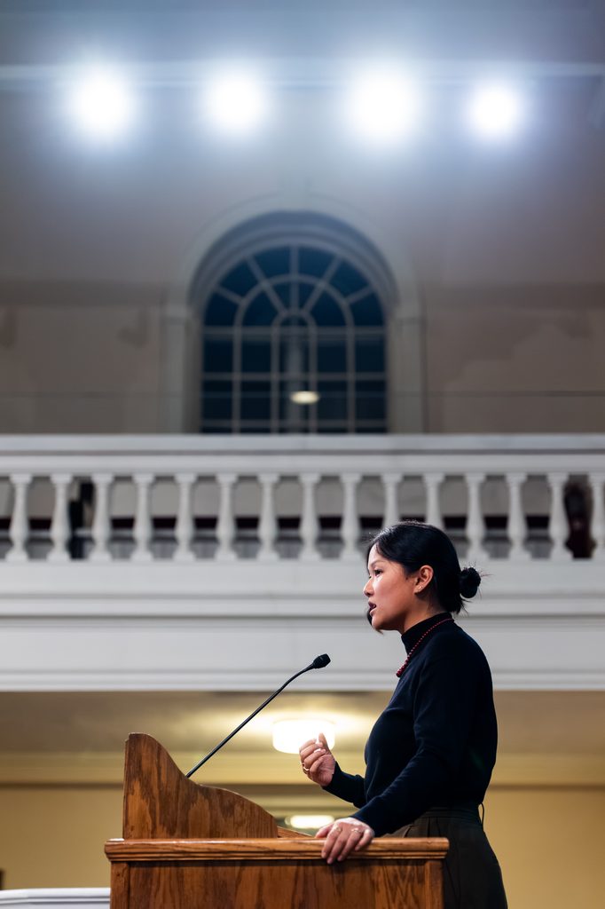 A person talks in Lorimer Chapel. 